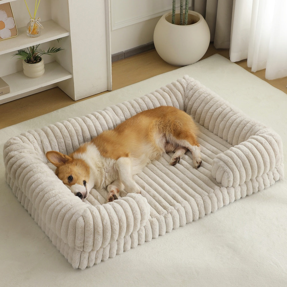 Dog lying on a plush Orthopedic Joint Support Dog Bed in a cozy living room.