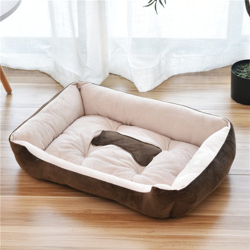 Brown and beige Soft Orthopedic Dog Bed on a wooden floor with white curtains in the background